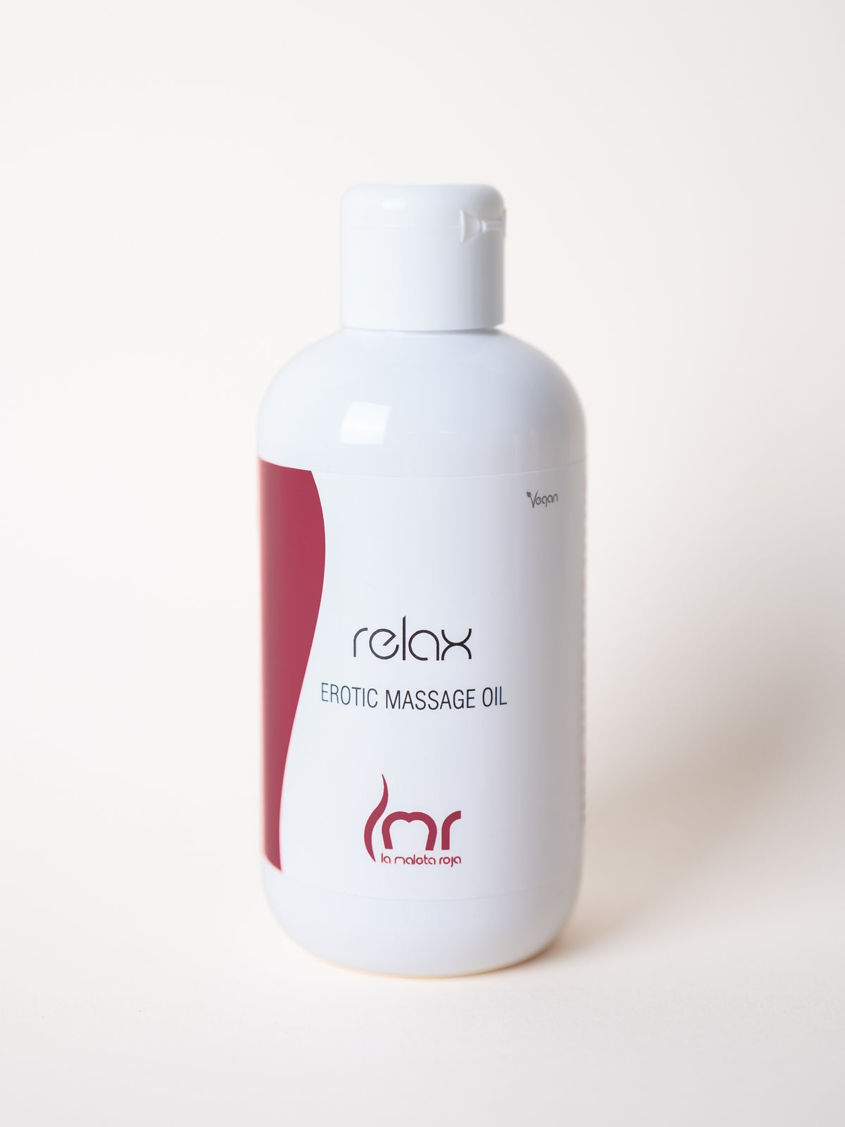 Frasco de Aceite Relax La Maleta Roja sobre superficie clara